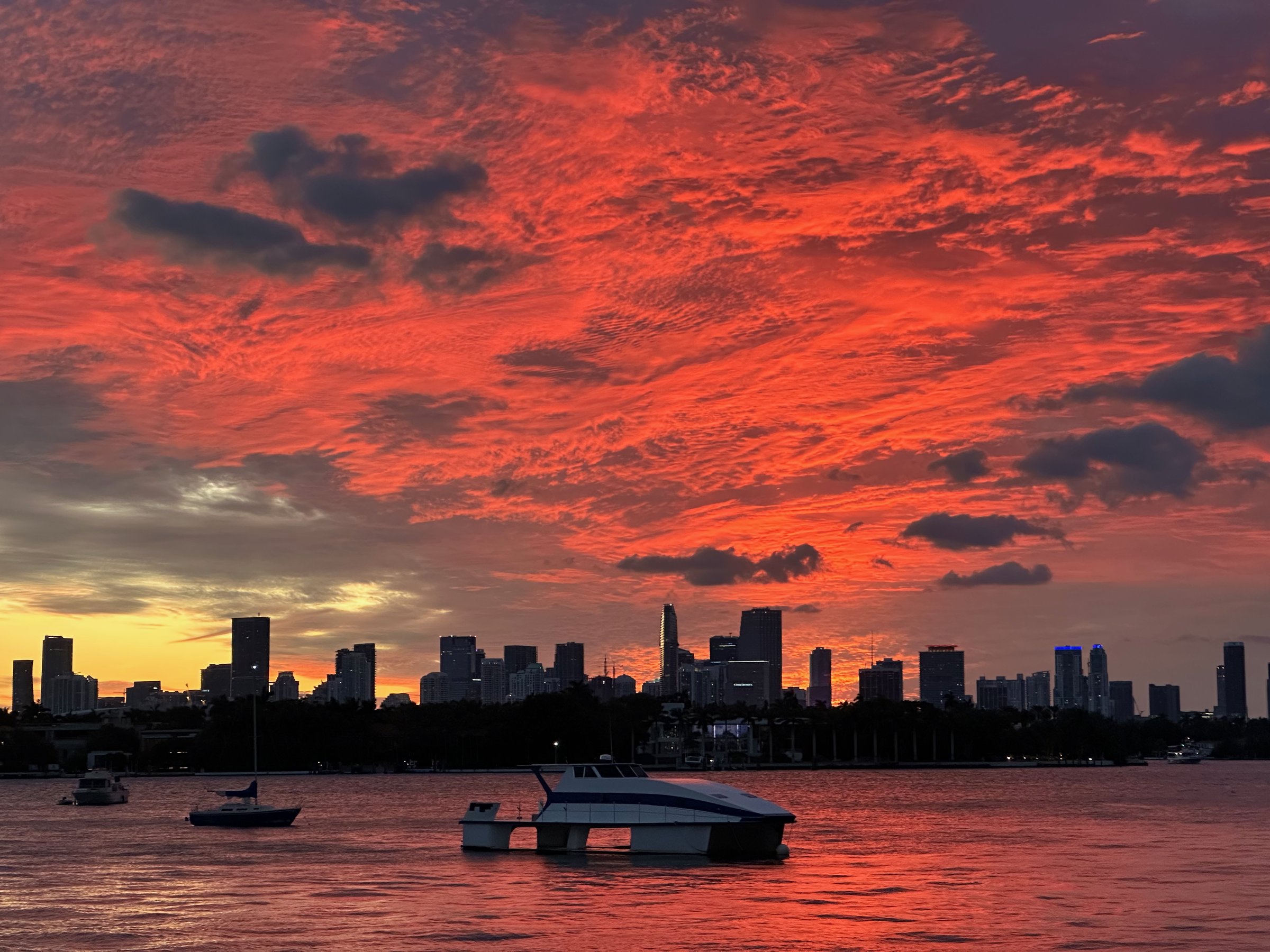 Blood-red sunset over Biscayne Bay with Miami skyline