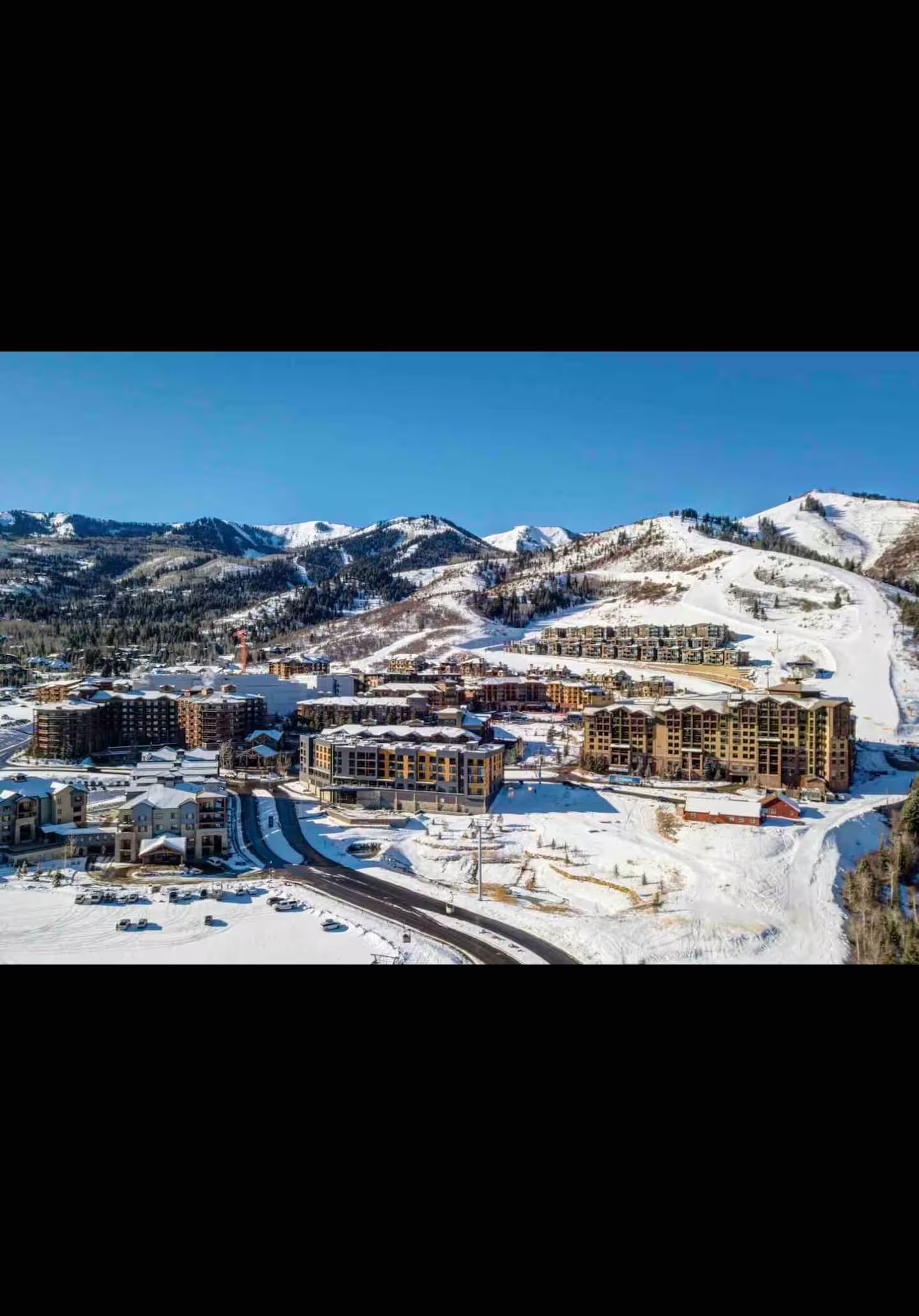 Aerial view of Canyons Village resort in snow