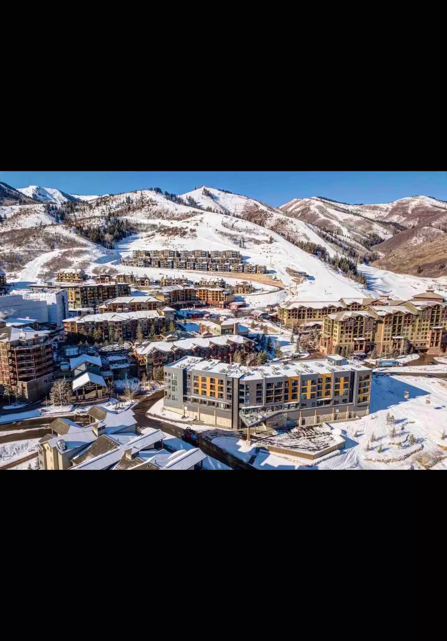 Aerial view of Canyons Village and surrounding mountains