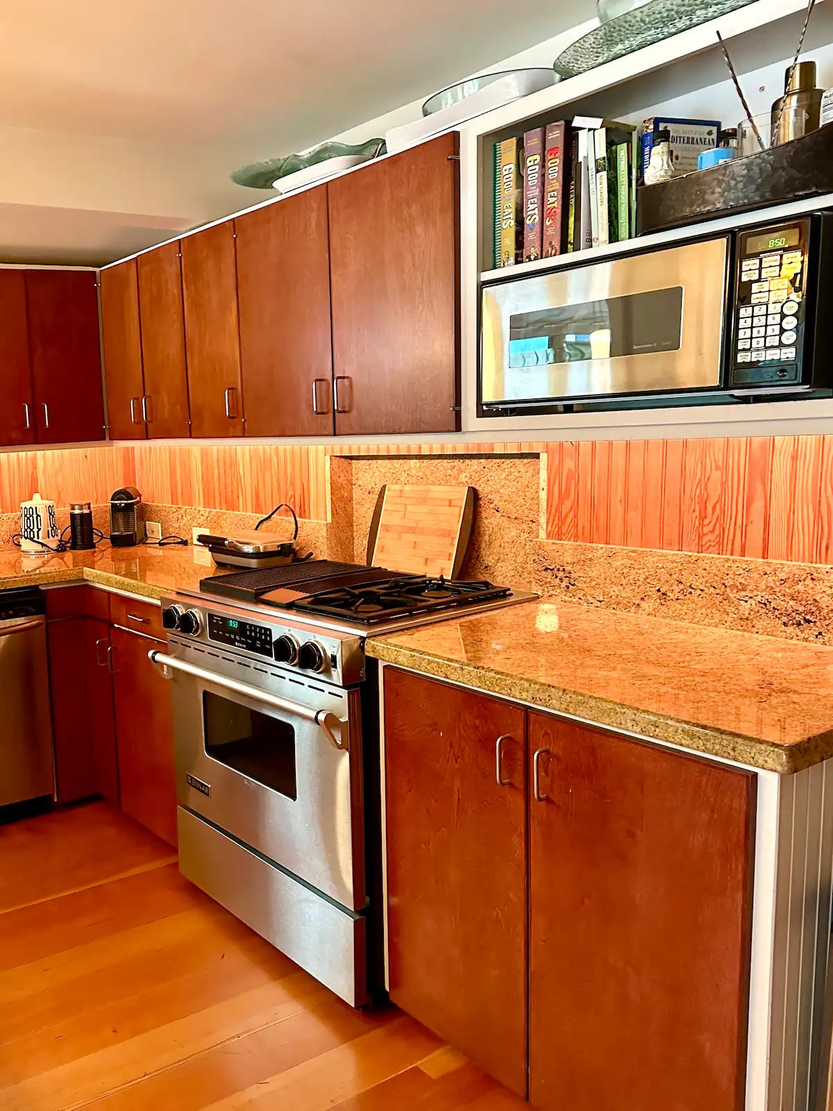 Kitchen with gas range, granite counters, cherry cabinets